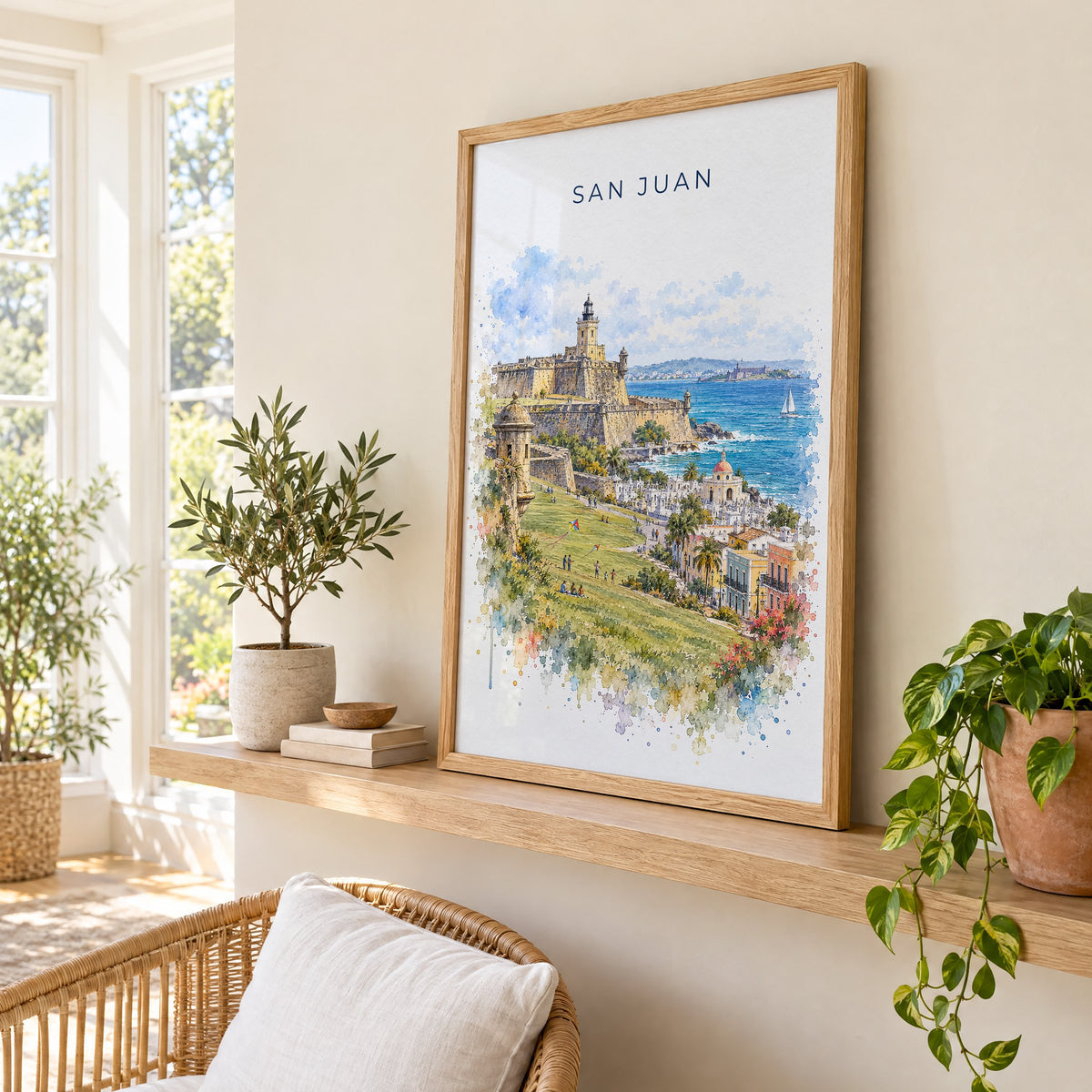 San Juan watercolor print in an oak frame on a picture ledge in a sunlit sunroom