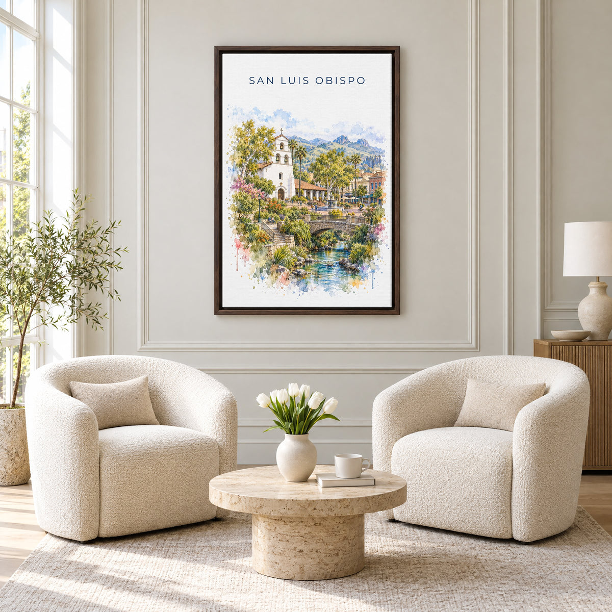 San Luis Obispo watercolor print as an espresso floater canvas above two boucle armchairs in a hotel lounge