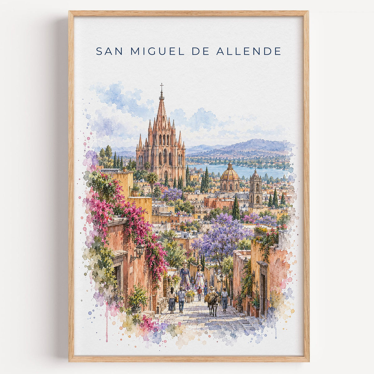 San Miguel de Allende watercolor print in a light oak frame on a plain white wall