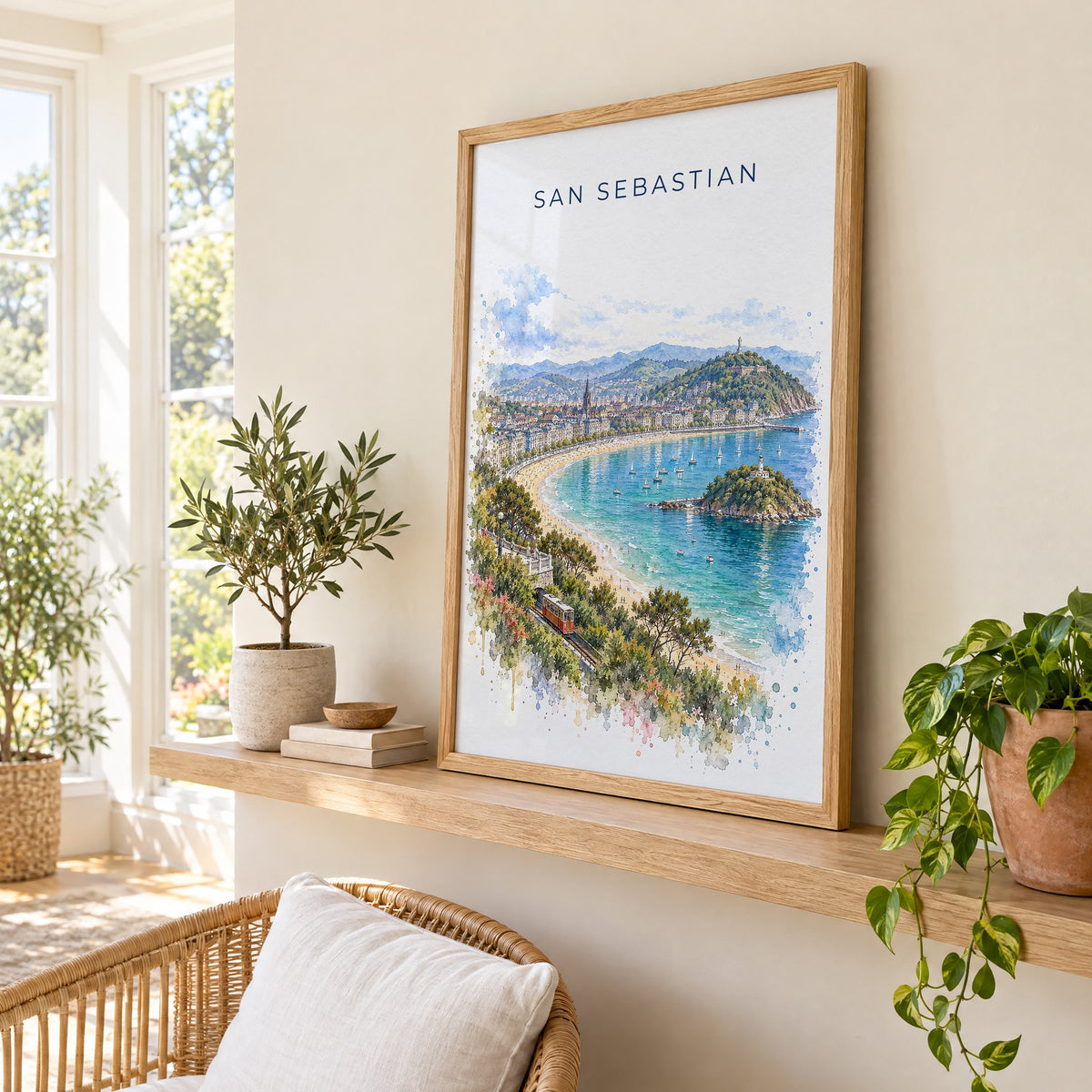 San Sebastian watercolor print in an oak frame on a picture ledge in a sunlit sunroom