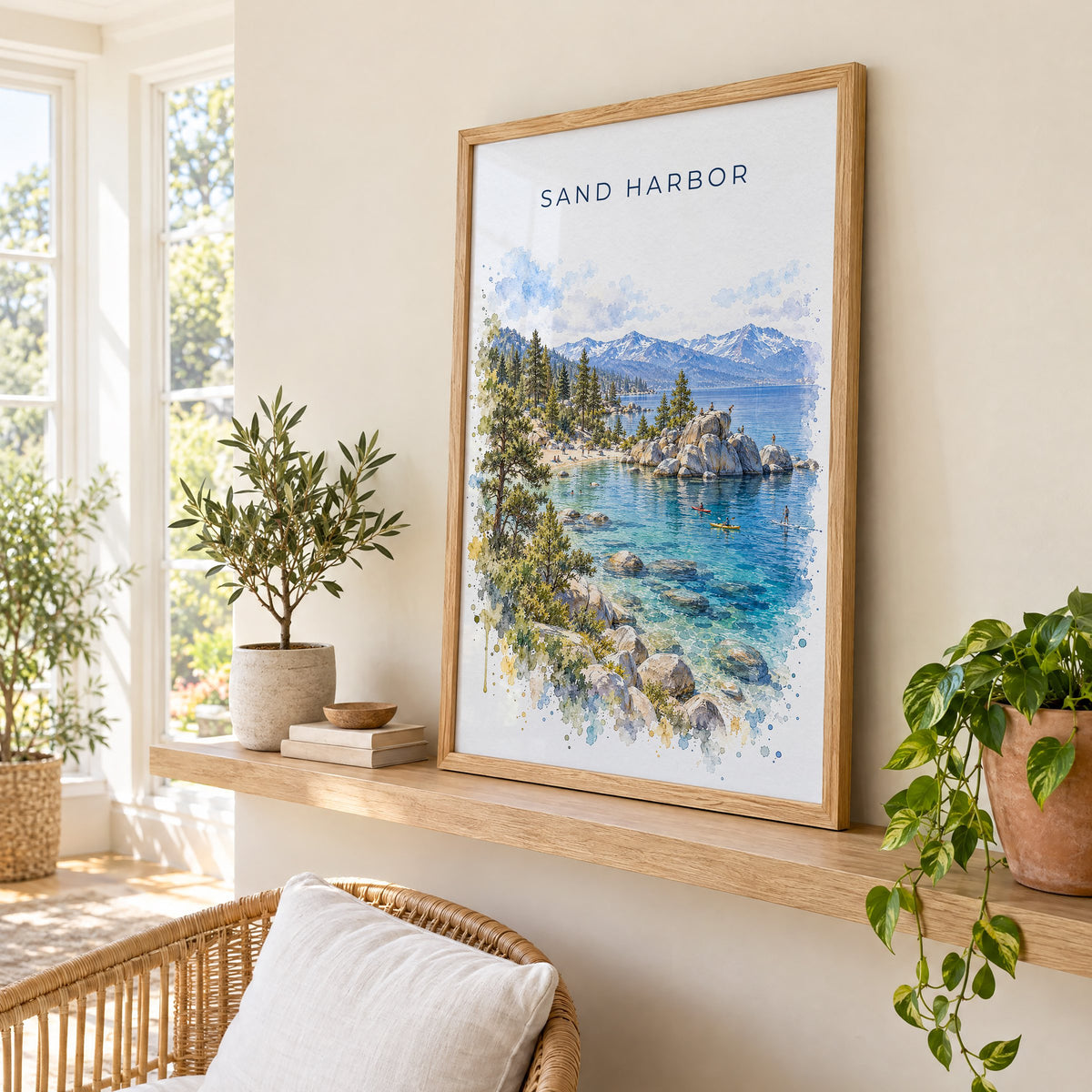 Sand Harbor watercolor print in an oak frame on a picture ledge in a sunlit sunroom