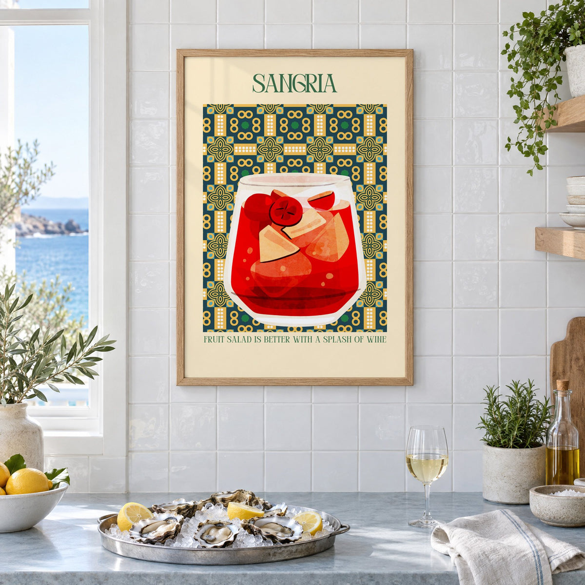 SANGRIA red glass patterned tile print in an oak frame on white tiles above a marble counter with oysters and lemons by a sea view