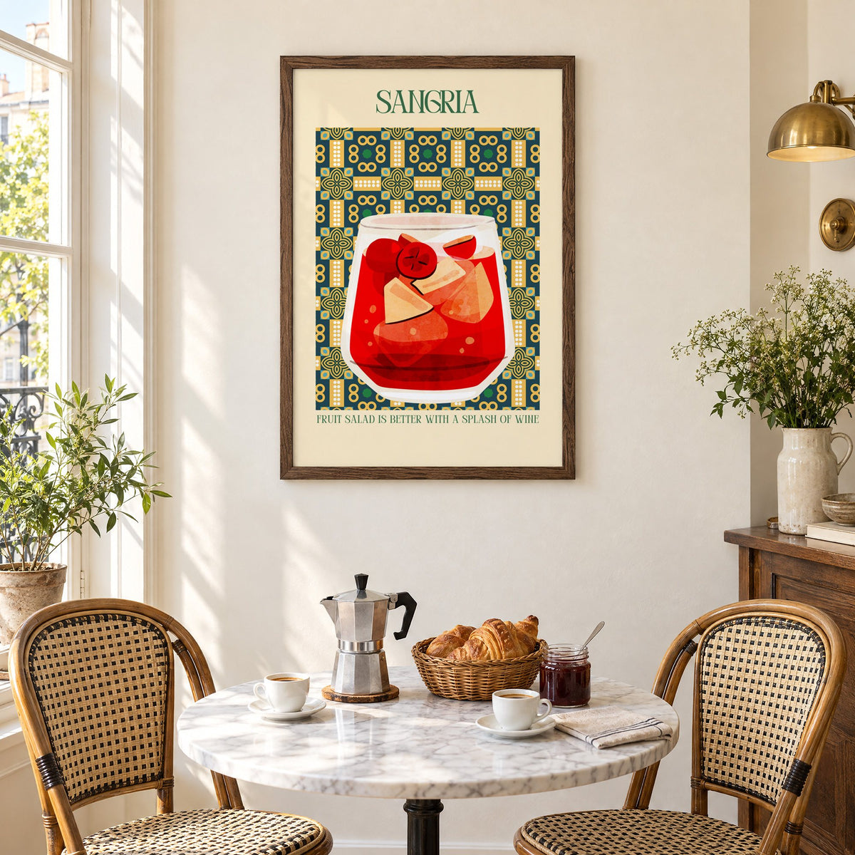 SANGRIA red glass patterned tile print in a walnut frame above a marble bistro table with croissants and rattan chairs