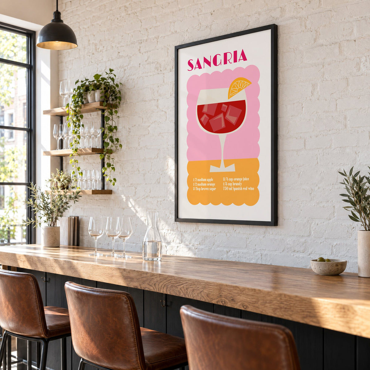 SANGRIA recipe pink and orange print in a black frame on a white brick wall above a wine bar counter