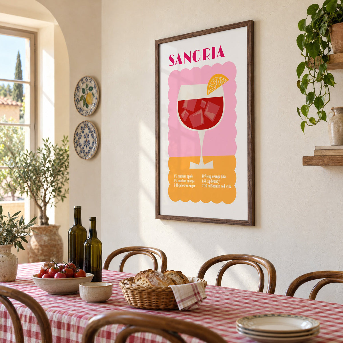 SANGRIA recipe pink and orange print in a walnut frame above a gingham-covered trattoria table, seen at an angle