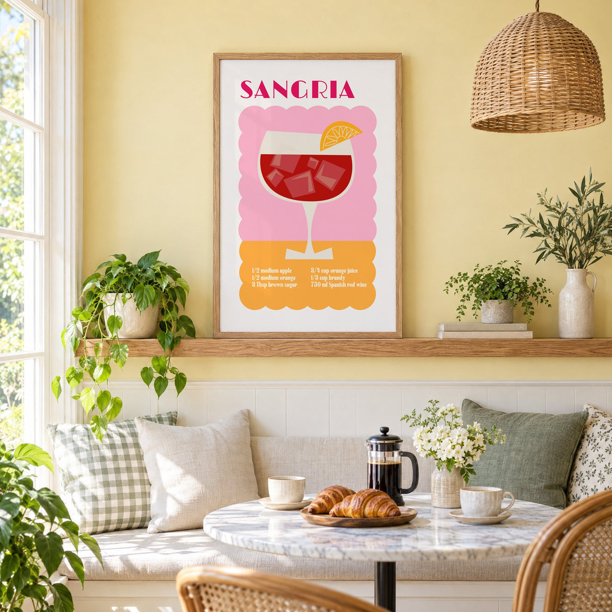 SANGRIA recipe pink and orange print in an oak frame on a picture ledge above a sunny breakfast nook