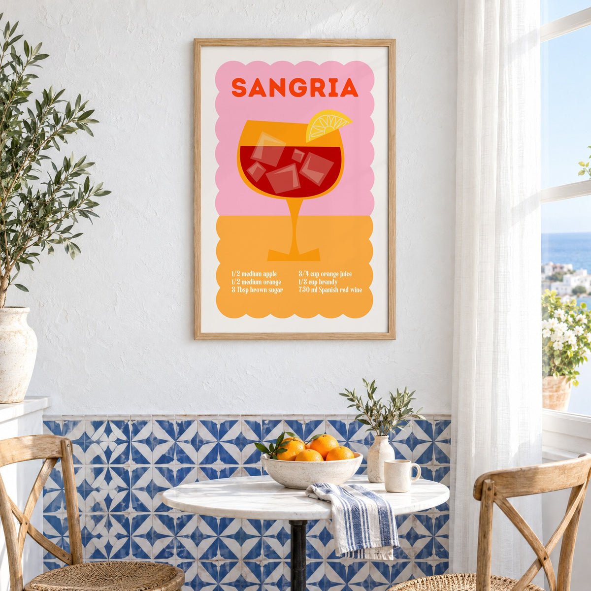 Sangria recipe pink and orange print in an oak frame above a bistro table and blue patterned tiles