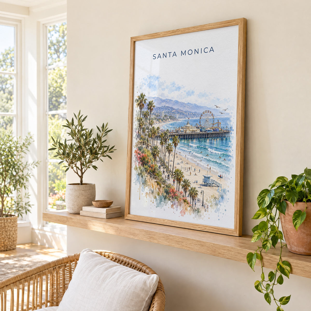 Santa Monica watercolor print in an oak frame on a picture ledge in a sunlit sunroom