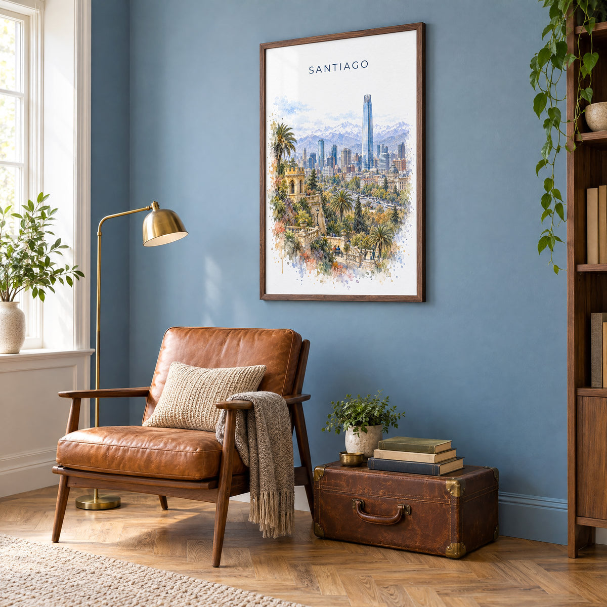 Santiago, Chile watercolor print in a walnut frame on a blue wall above a leather armchair in a reading nook
