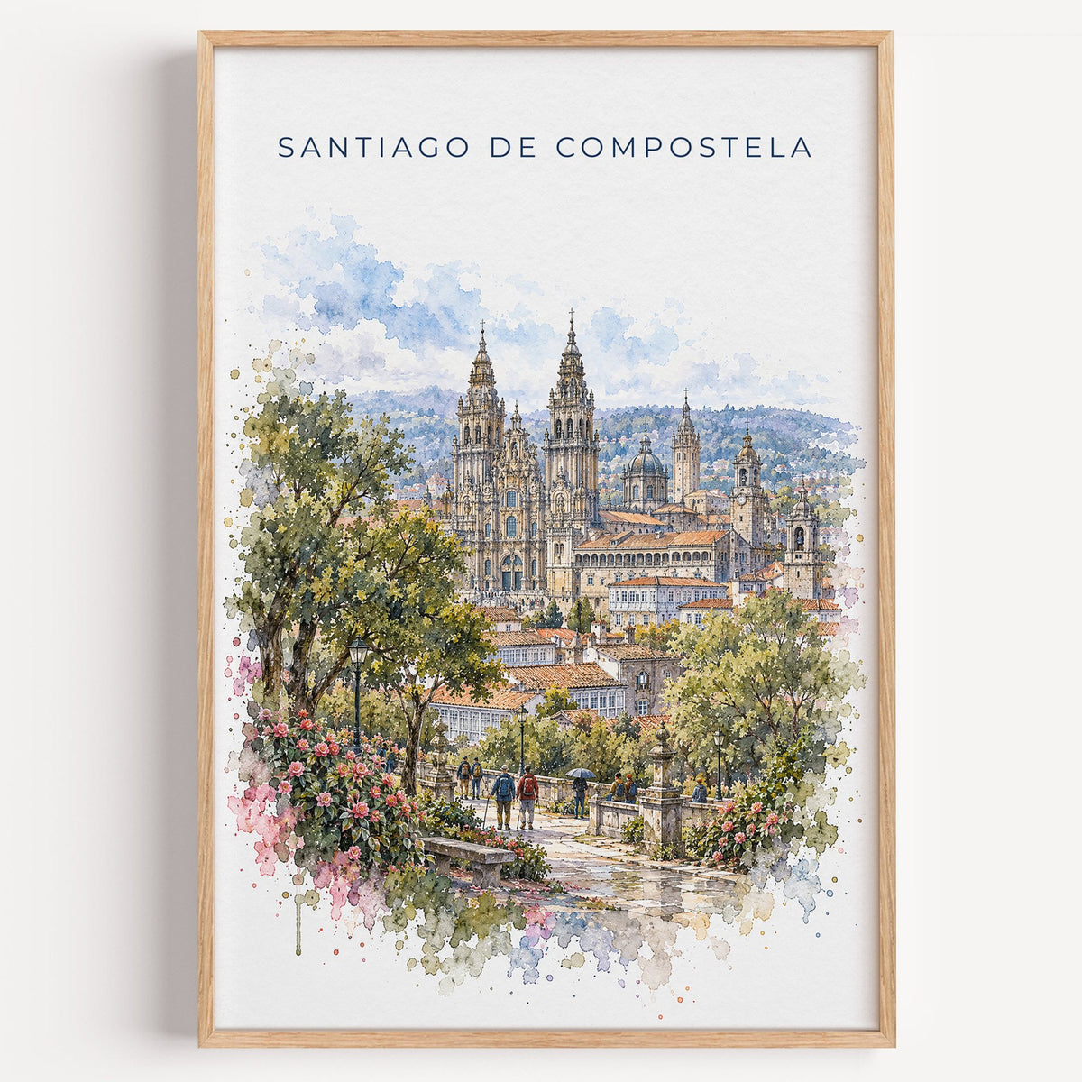 Santiago de Compostela watercolor print in a light oak frame on a plain white wall