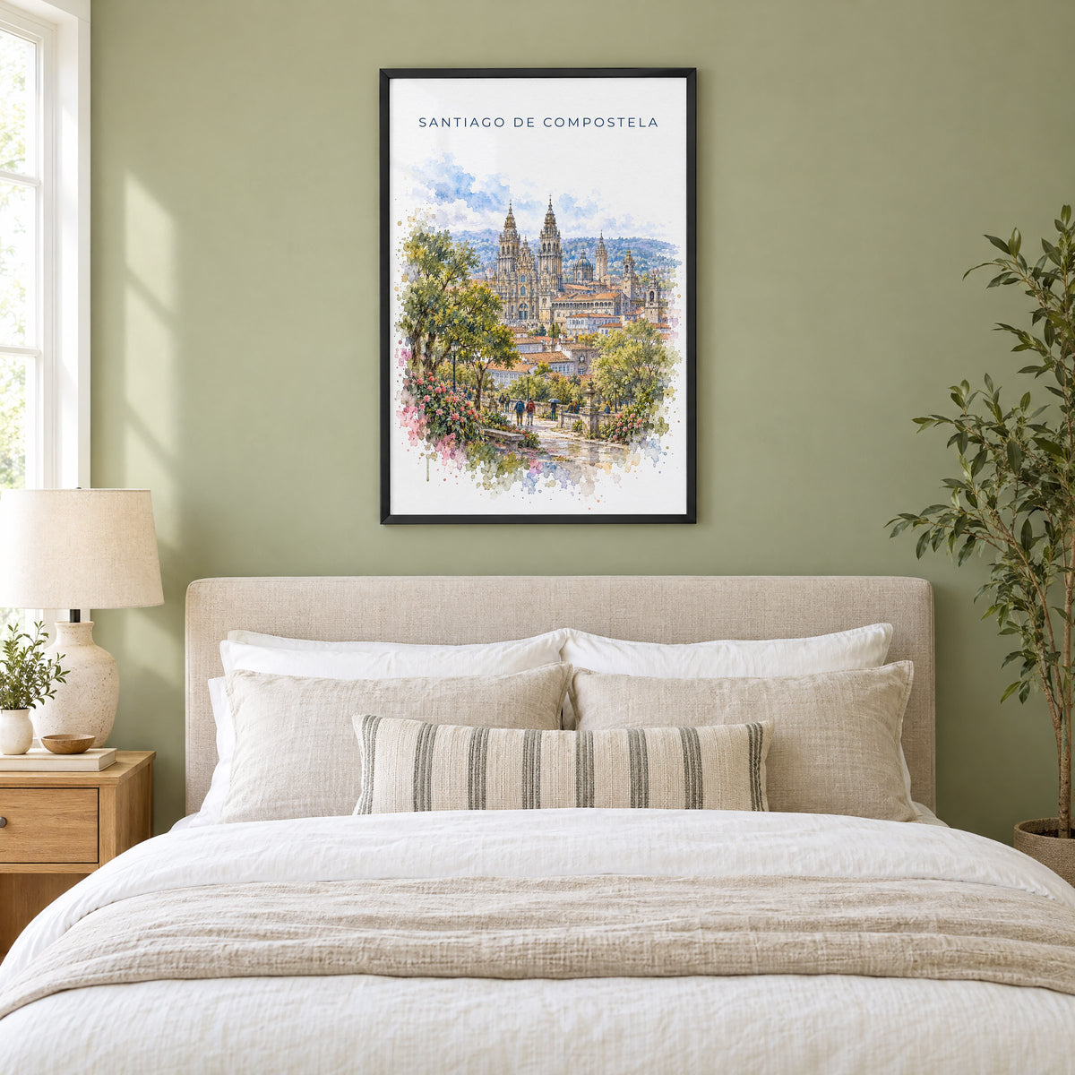 Santiago de Compostela watercolor print in a black frame above an upholstered headboard in a sage green bedroom