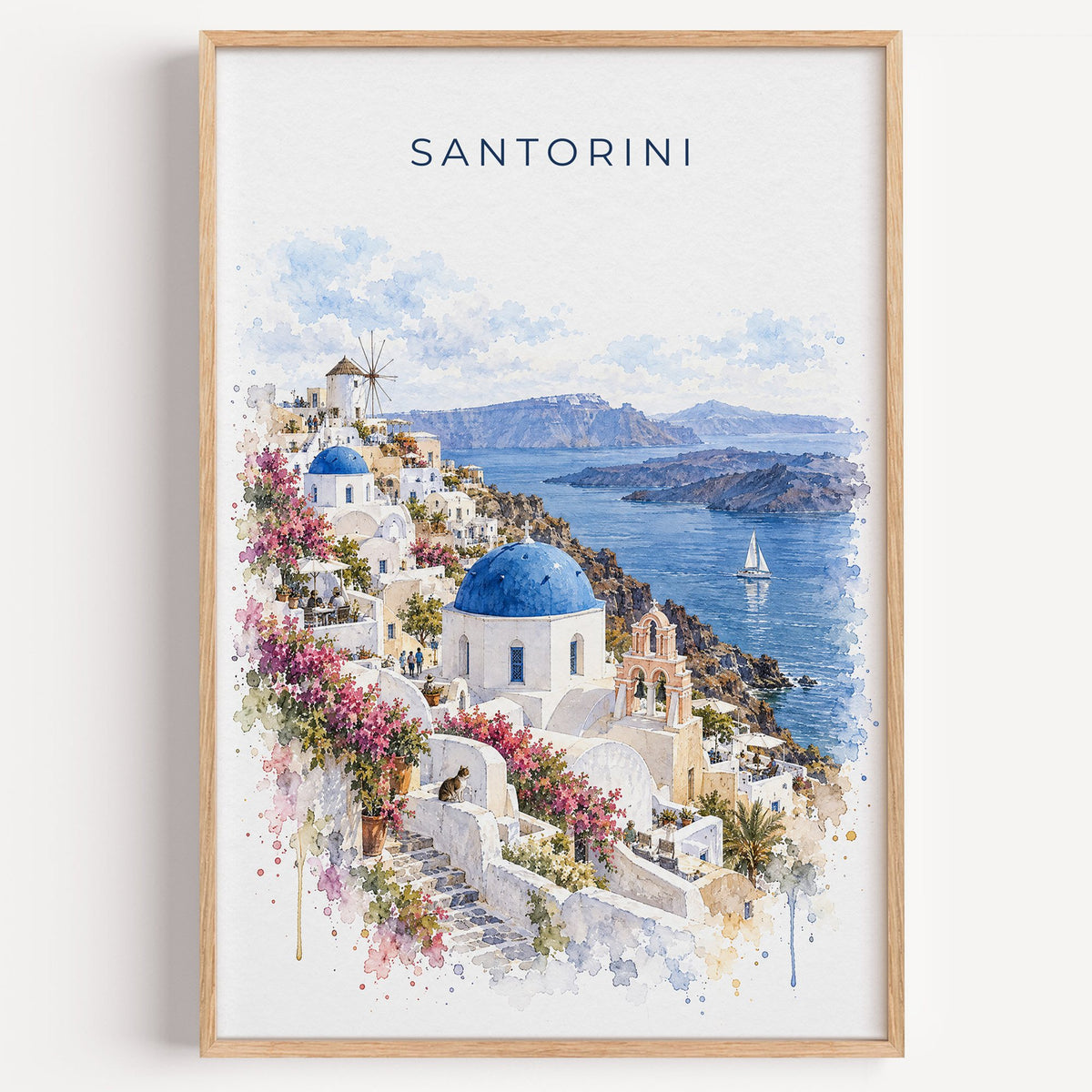 Santorini watercolor print in a light oak frame on a plain white wall