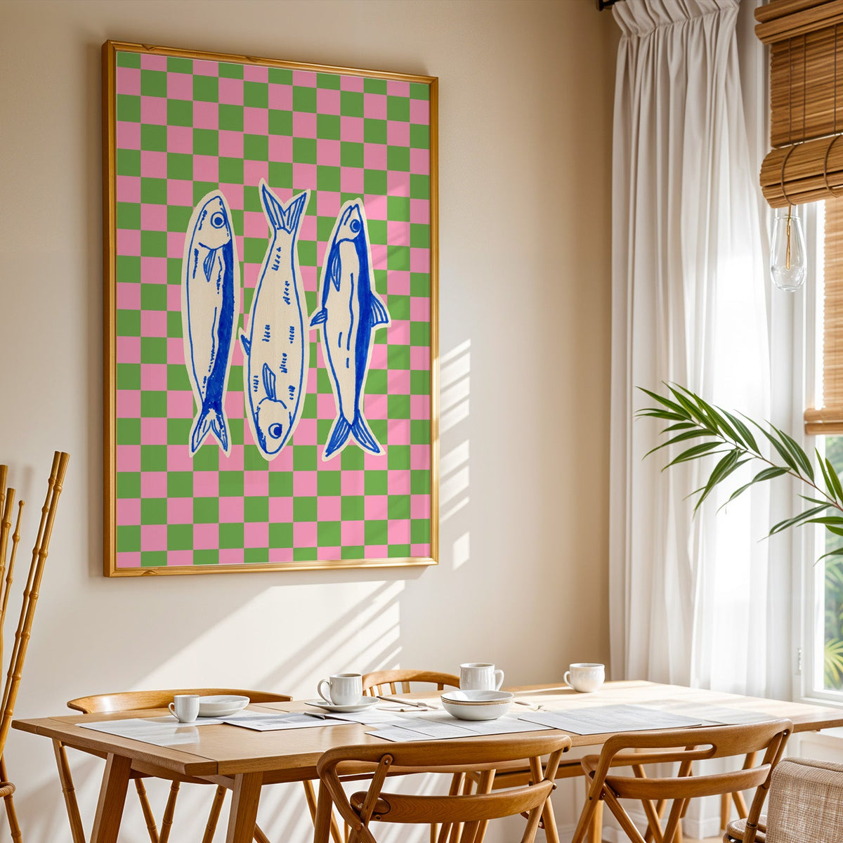 Sardines checkerboard print shown in a gold frame above a breakfast table by a curtained window
