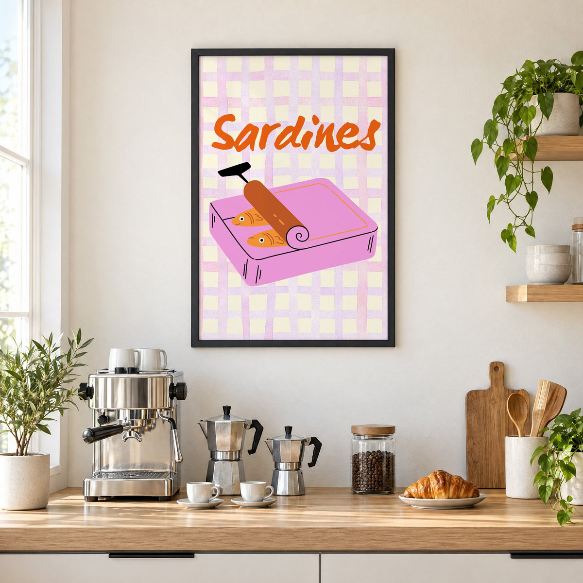 Sardines pink tin on gingham print in a black frame above a home espresso bar with moka pots and espresso cups
