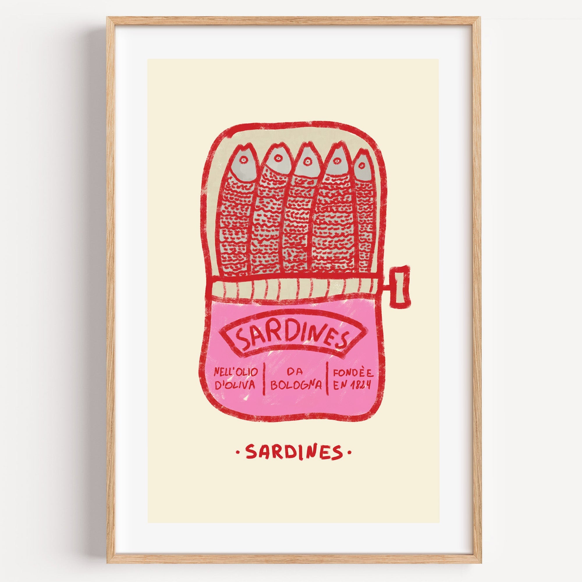 Pink sardine tin print in a light oak frame on a plain white wall