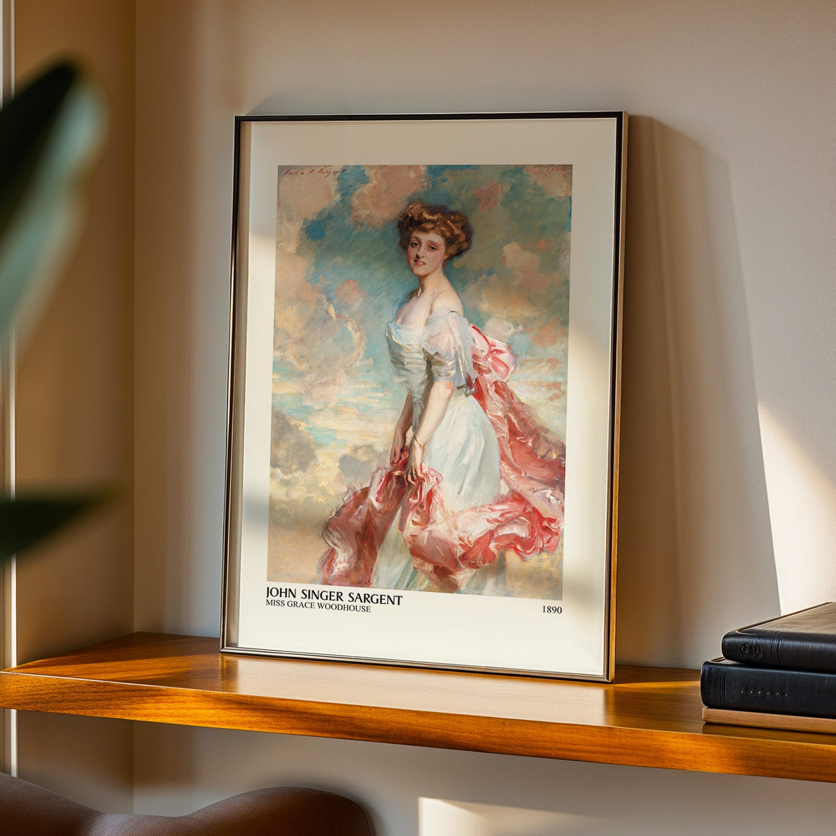 Sargent society portrait print in a black frame on a walnut shelf in evening light