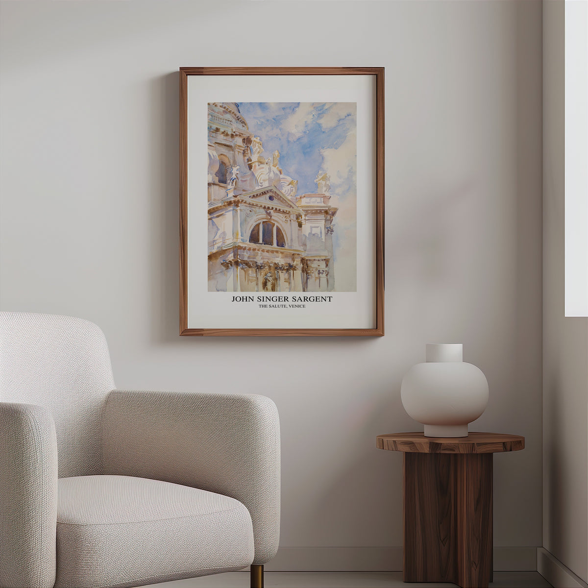 Venice watercolour print in a slim walnut frame above a bouclé armchair