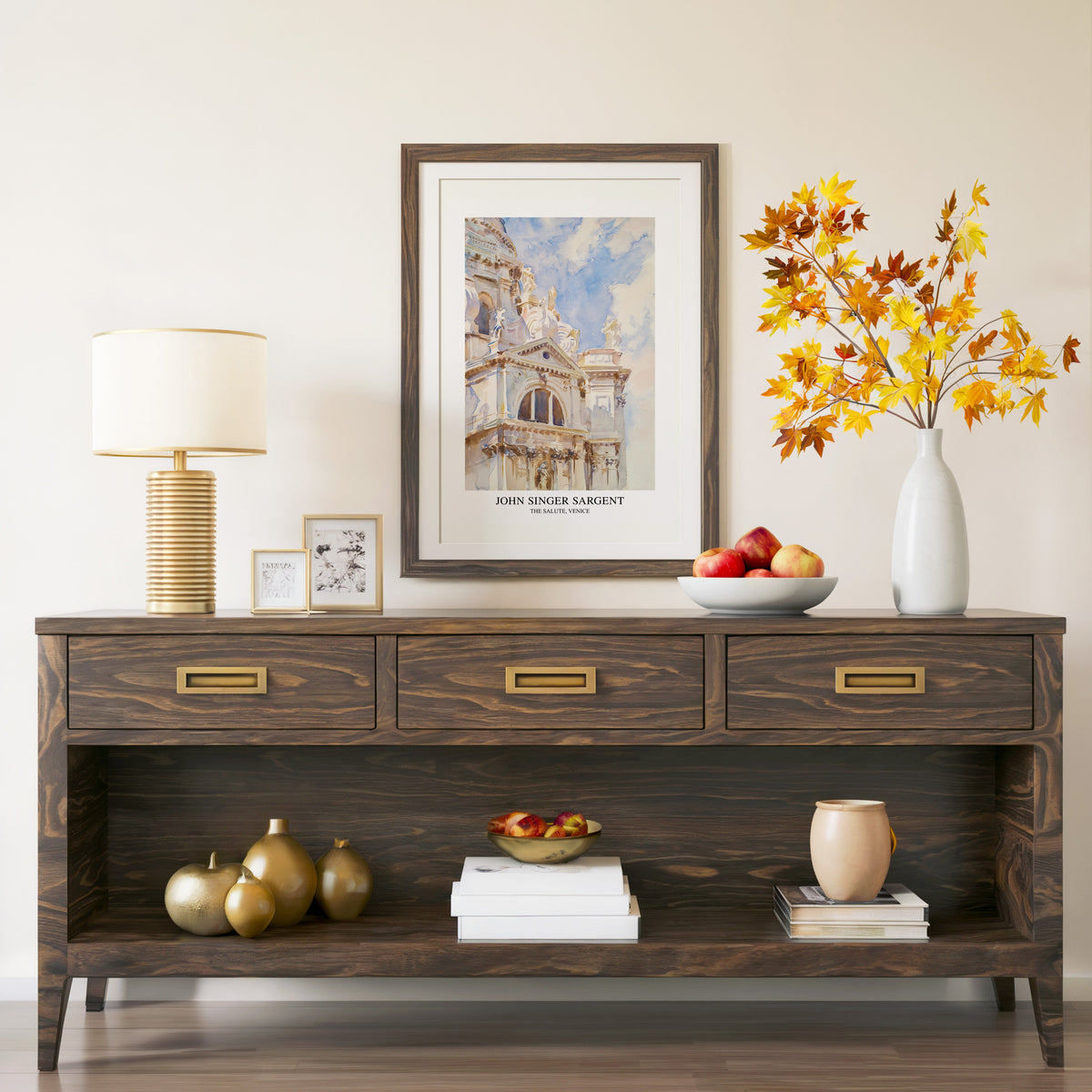 The Salute Venice print in a walnut frame above a console with autumn branches