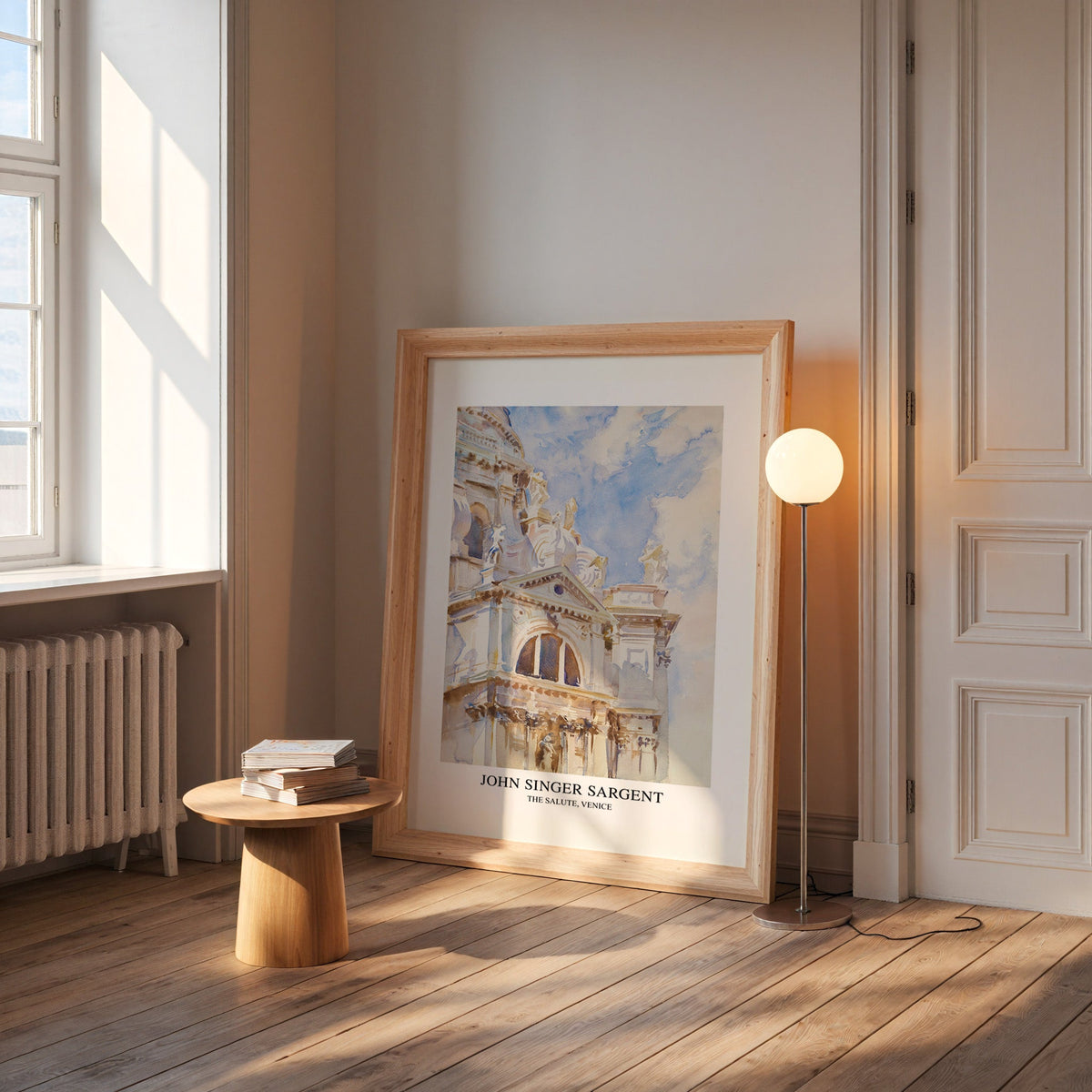Salute Venice print in a wide pine frame leaning by a sunlit window