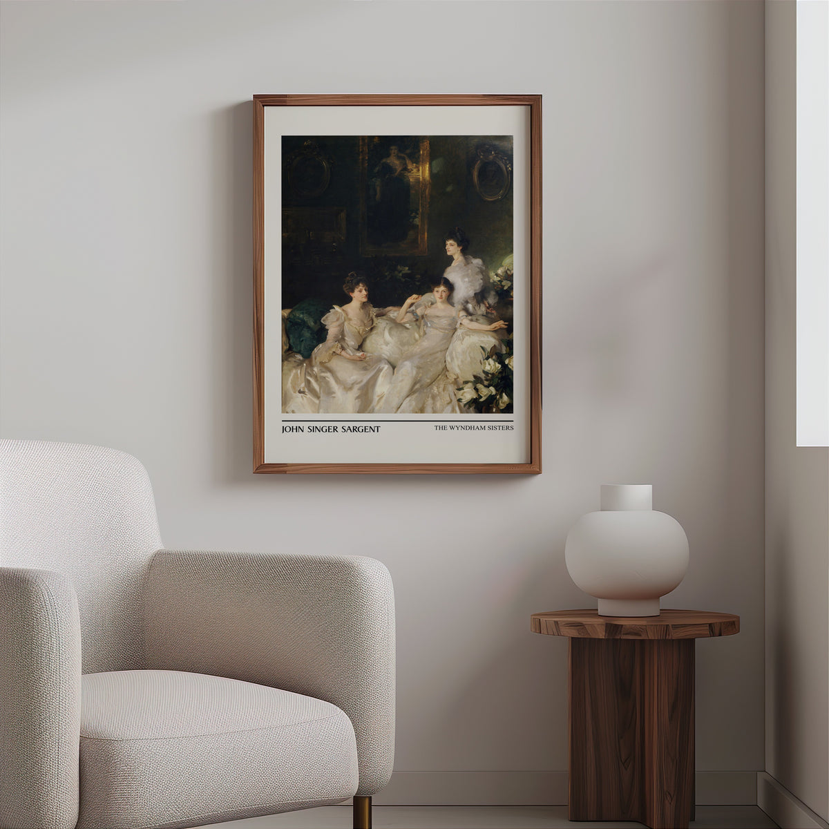 Group portrait print in a slim walnut frame above a bouclé armchair