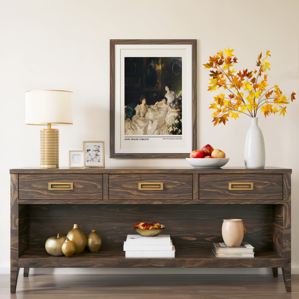 The Wyndham Sisters print in a walnut frame above a console with autumn branches