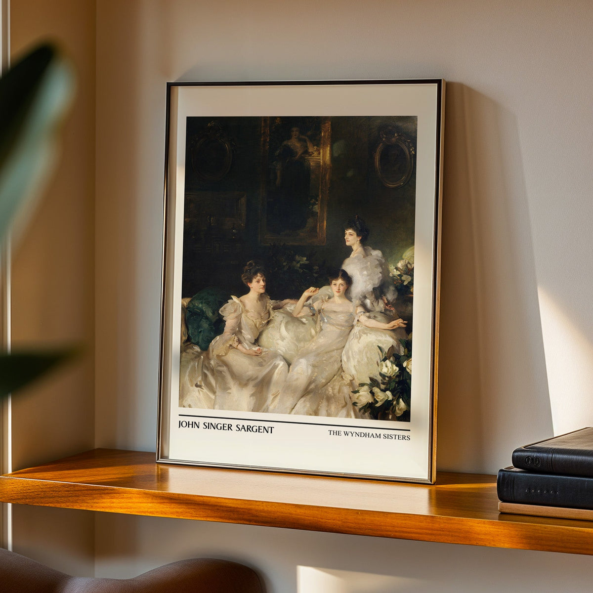 Dark interior portrait print in a black frame on a walnut shelf in evening light