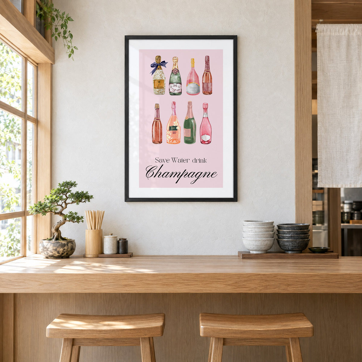 Save Water drink Champagne bottles watercolor print in a black frame above a light wood ramen counter with stools and stacked bowls