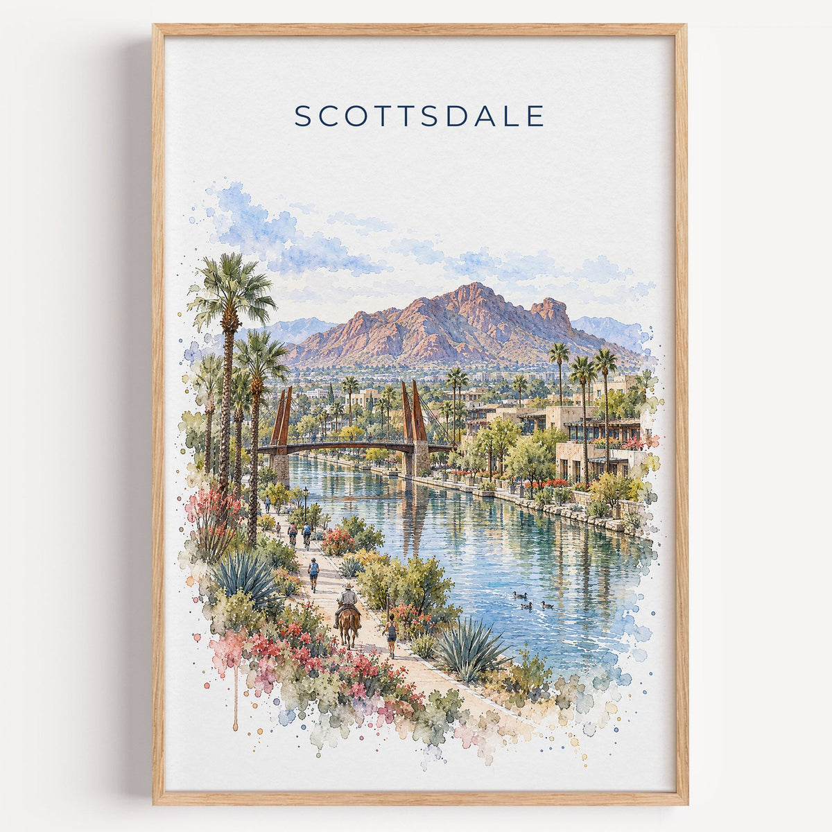 Scottsdale watercolor print in a light oak frame on a plain white wall
