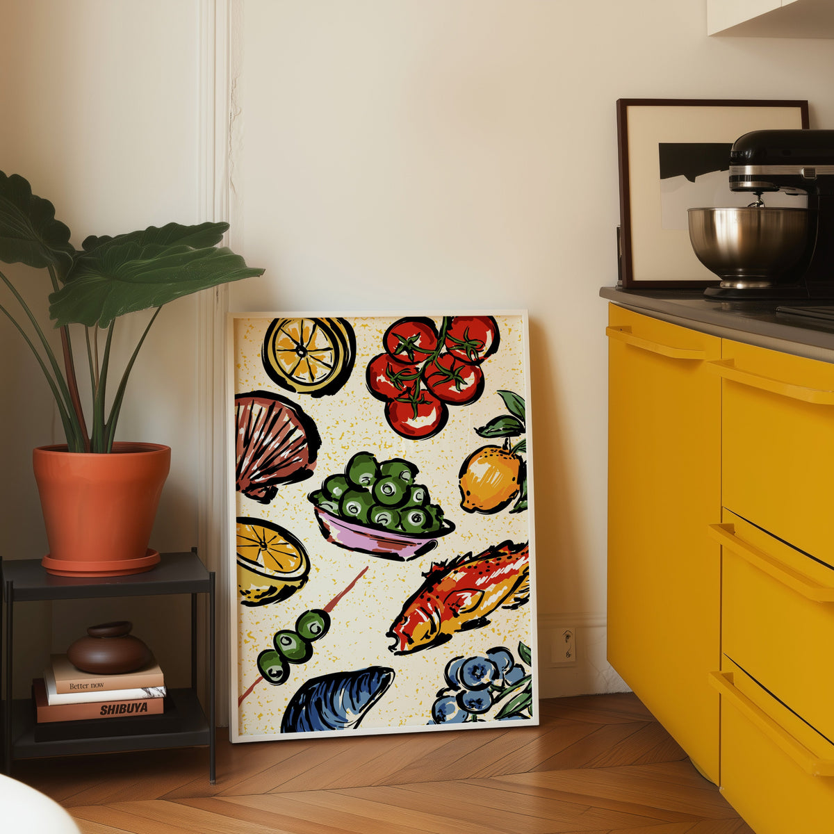 Seafood citrus pattern print in a white frame leaning on parquet beside a bright yellow kitchen