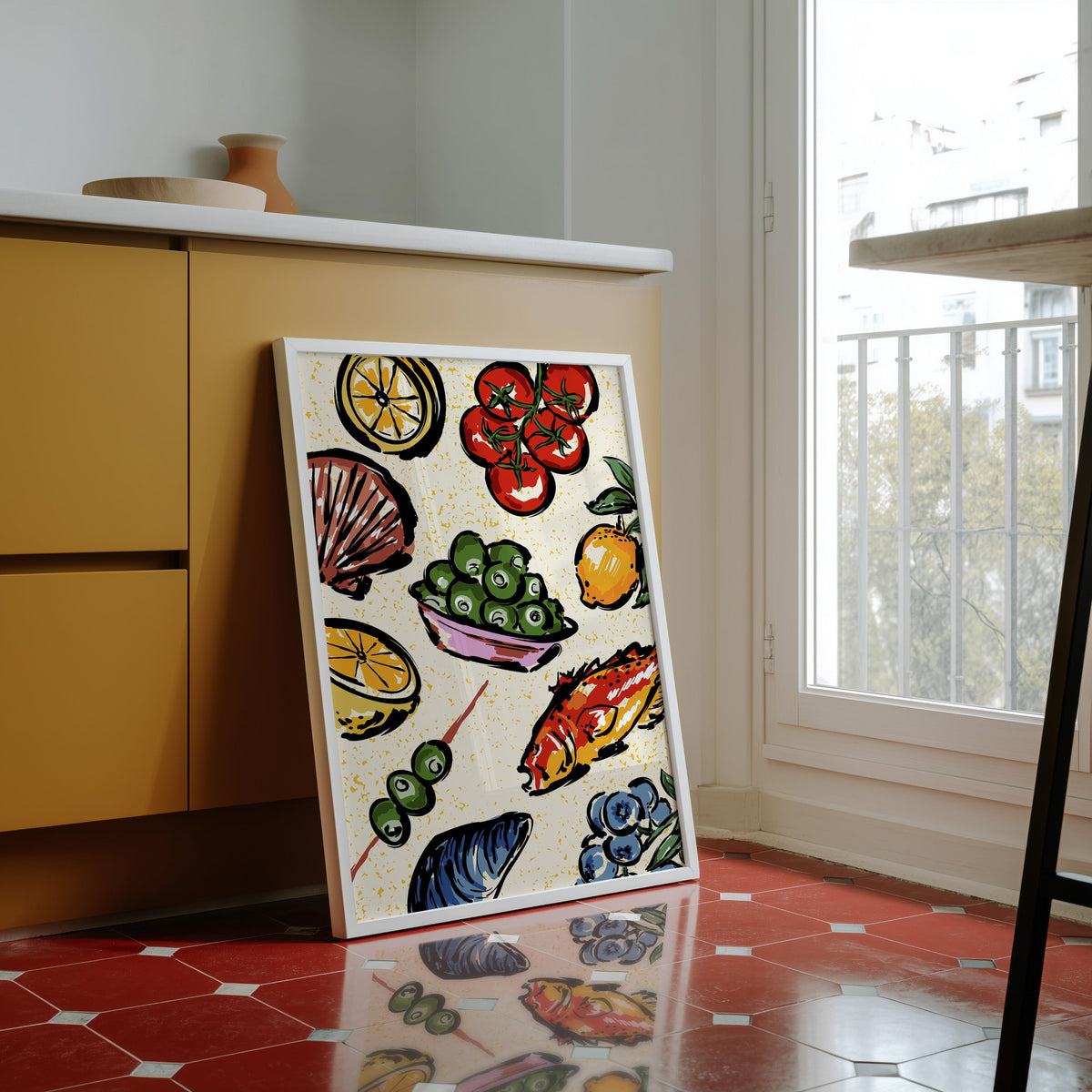 Seafood citrus pattern print in a white frame against yellow cabinets on a red tiled floor