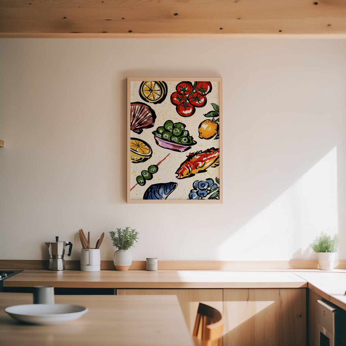 Seafood citrus pattern print in an oak frame above a wood counter with a moka pot and herbs