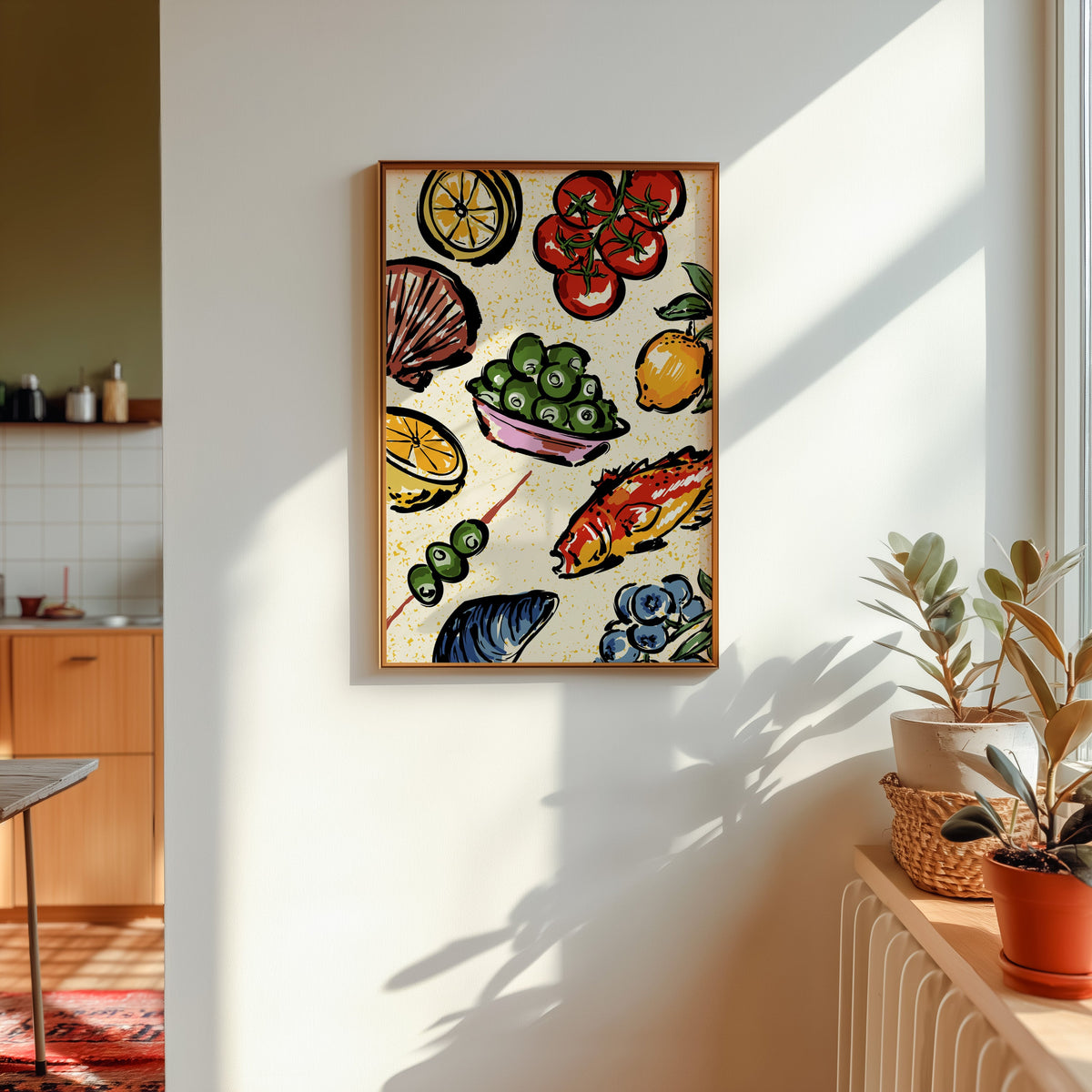 Seafood citrus pattern print shown in a gold frame in sunlight with plants and a kitchen beyond