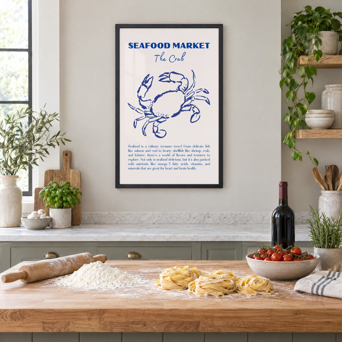 SEAFOOD MARKET The Crab cobalt sketch print in a black frame above a butcher-block island with fresh pasta, flour and cherry tomatoes