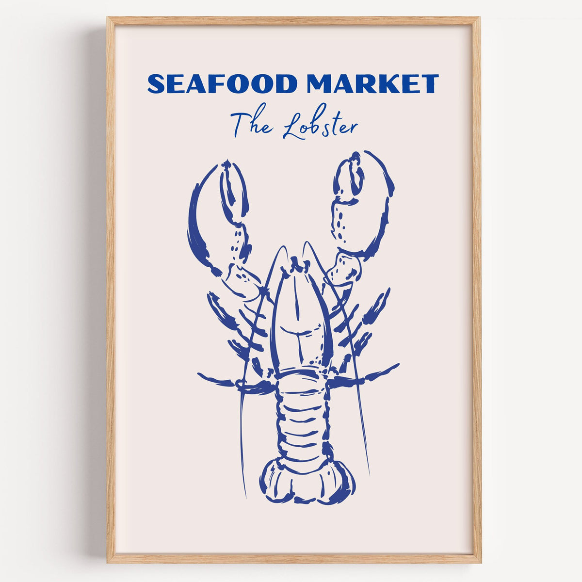 SEAFOOD MARKET The Lobster cobalt sketch print in a light oak frame on a plain white wall
