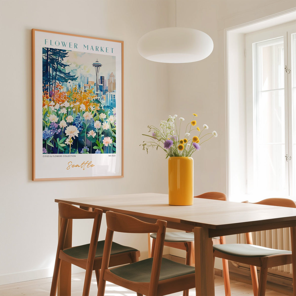 Seattle flower market print in an oak frame above a dining table with a yellow vase and white pendant light