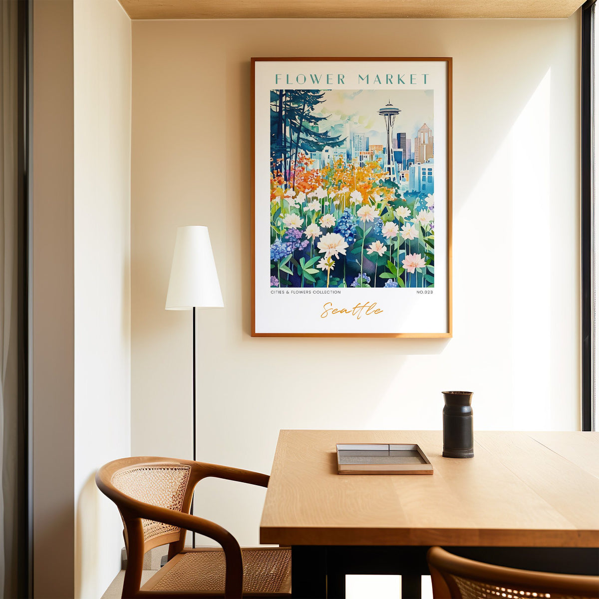 Seattle flower market print in an oak frame above a dining table and cane chair