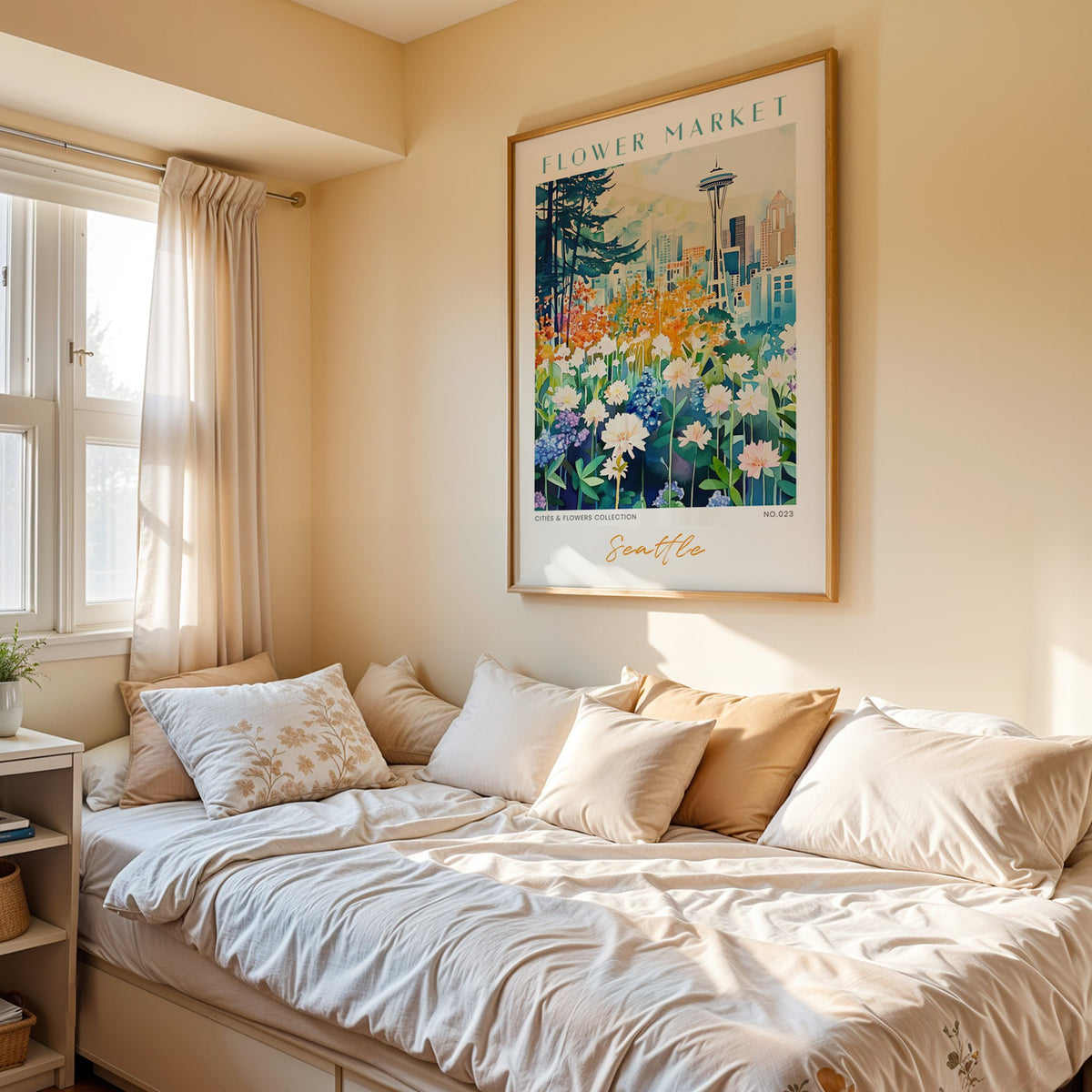 Seattle flower market print in an oak frame above a cream daybed in a sunny bedroom