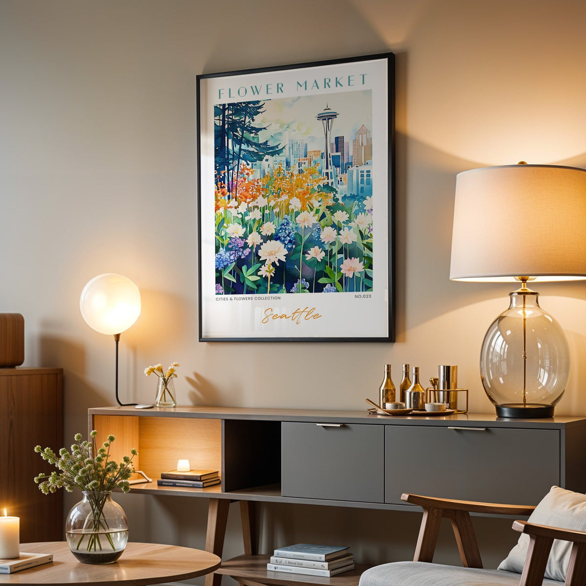Seattle flower market print in a black frame above a grey media console with a glass table lamp