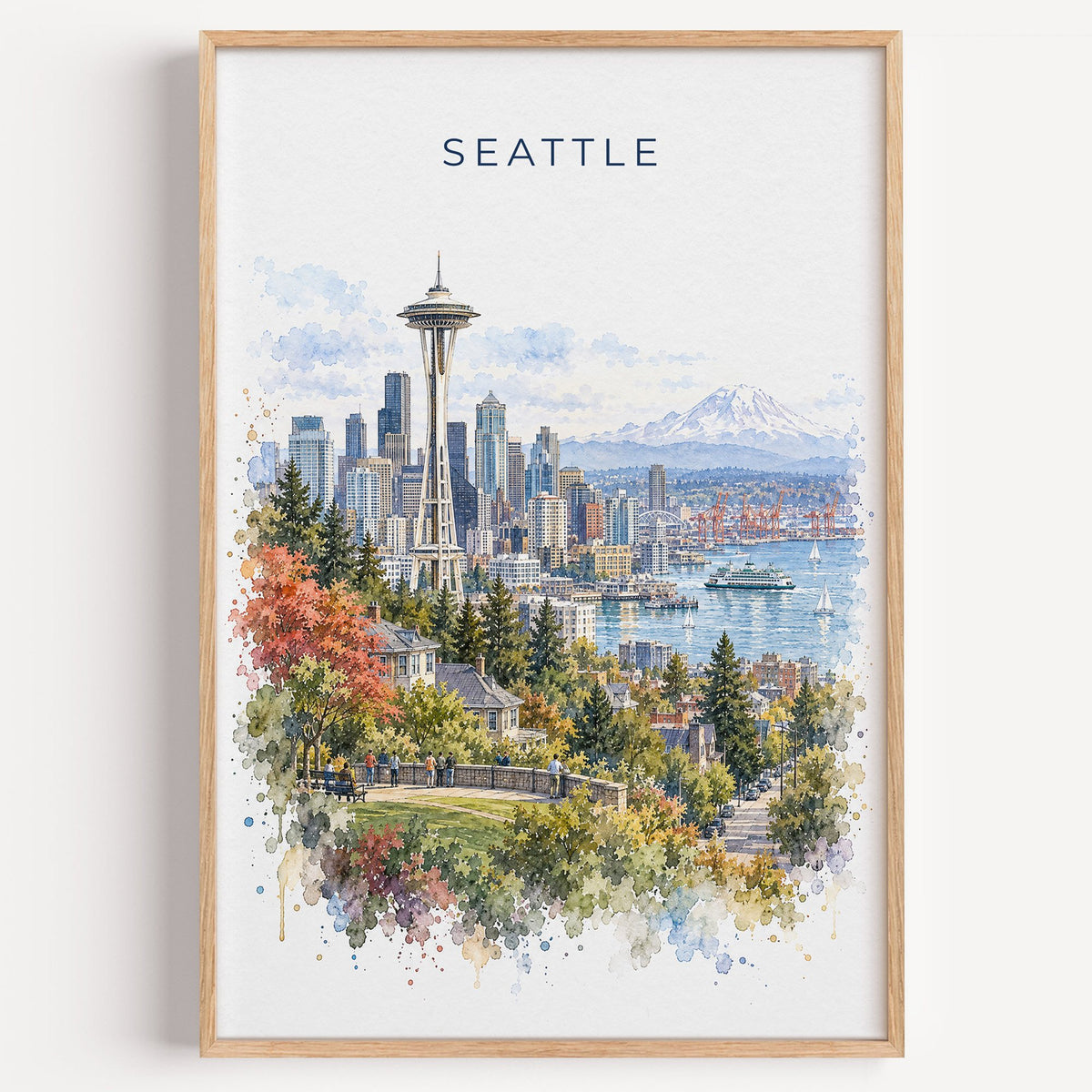 Seattle watercolor print in a light oak frame on a plain white wall