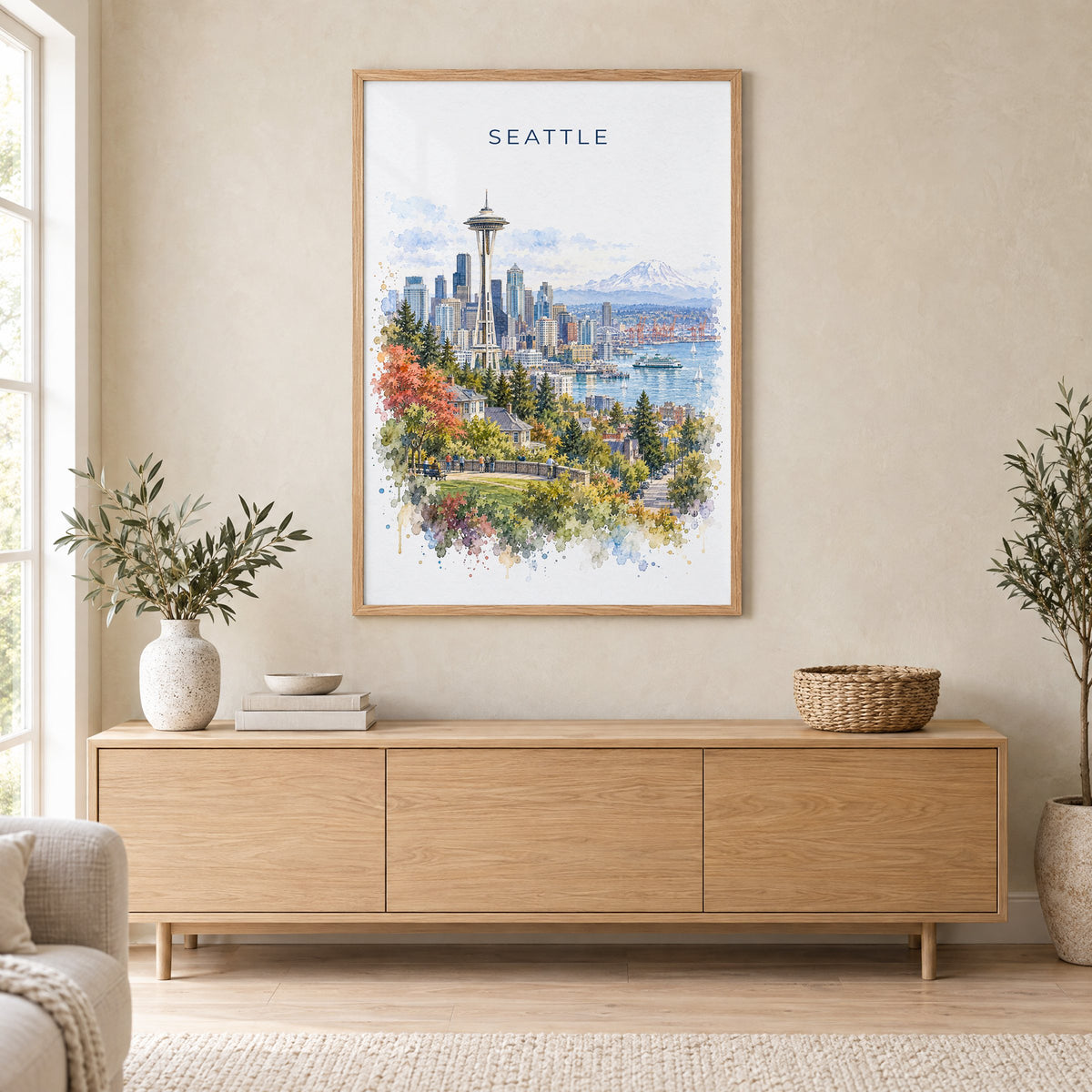 Seattle watercolor print in an oak frame above a light wood sideboard in a Scandinavian living room