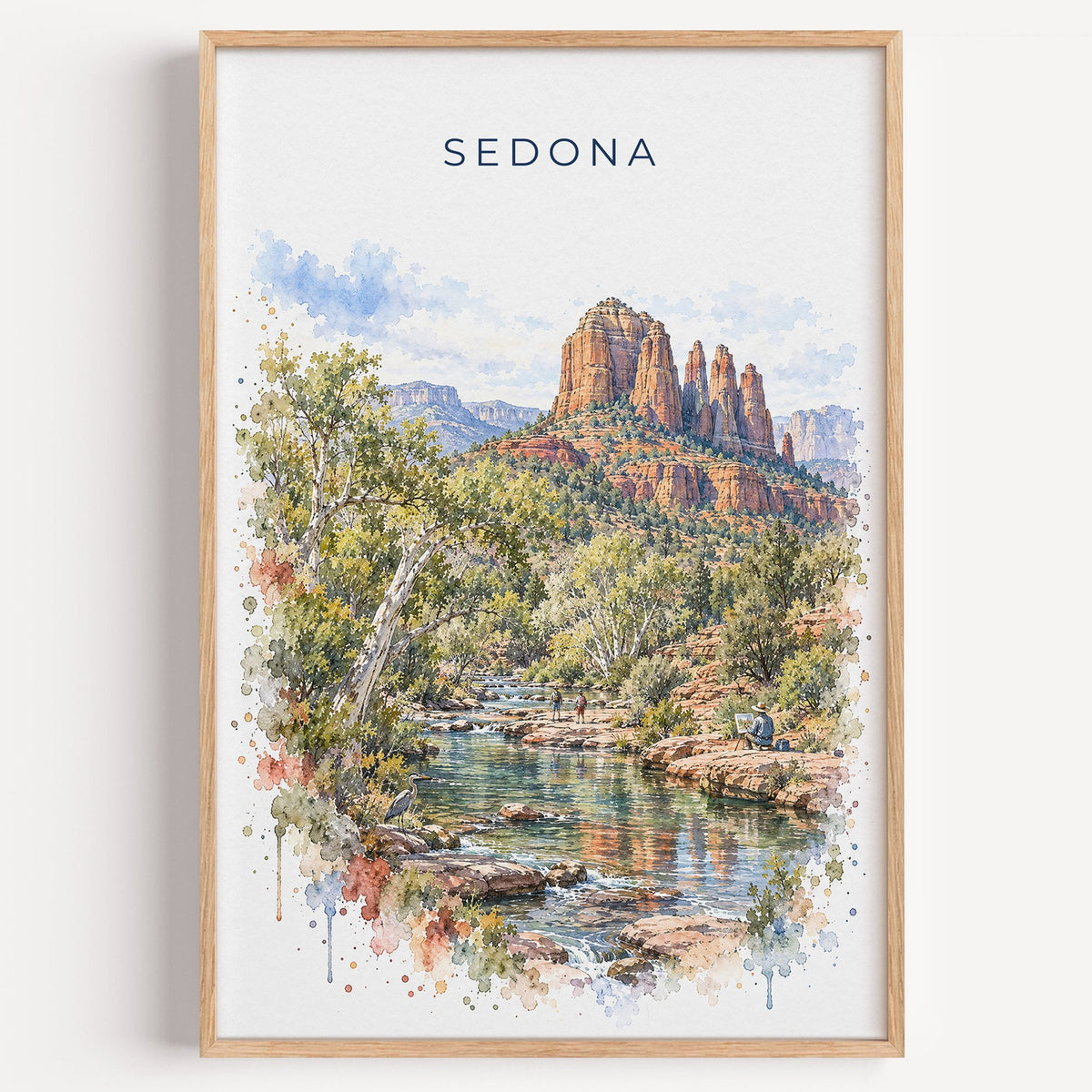 Sedona watercolor print in a light oak frame on a plain white wall