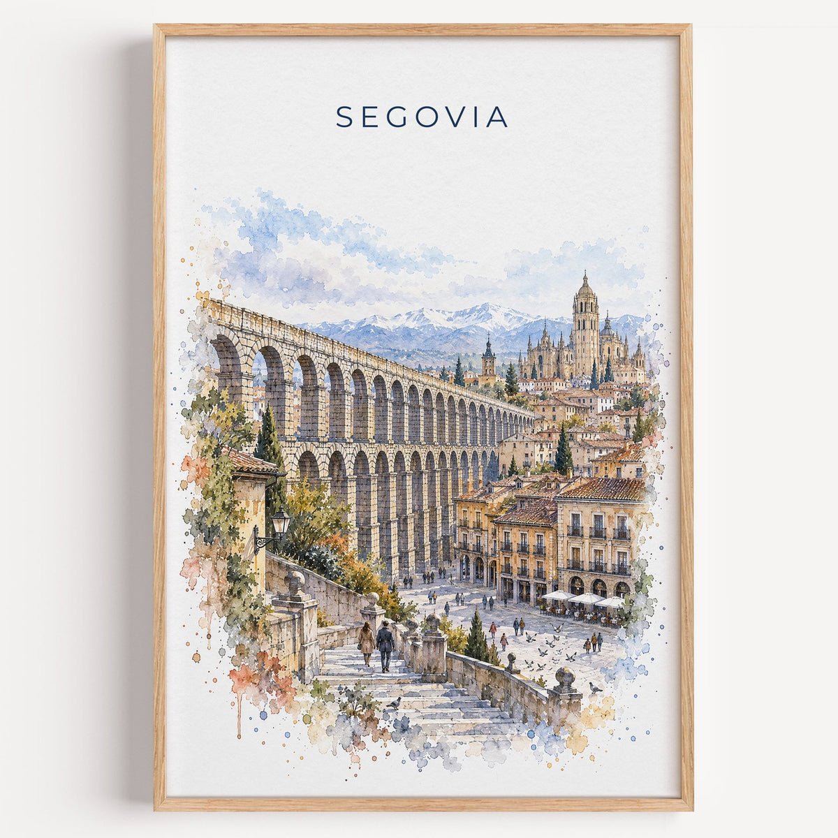 Segovia watercolor print in a light oak frame on a plain white wall