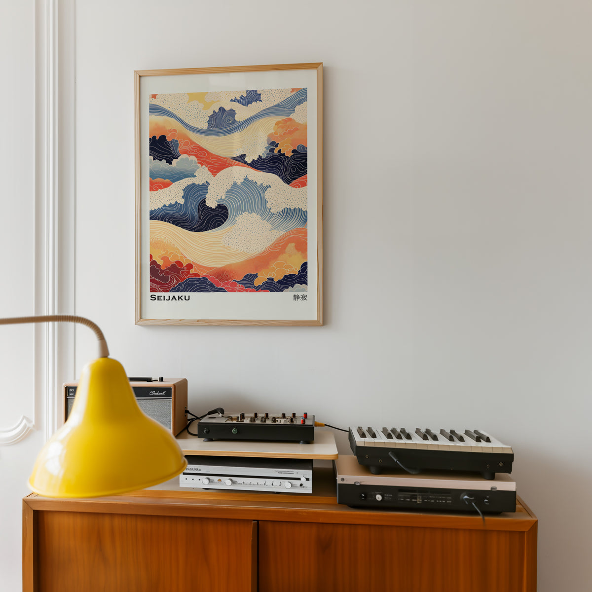 Orange and navy Seijaku waves print in an oak frame above a teak sideboard with vintage hi-fi