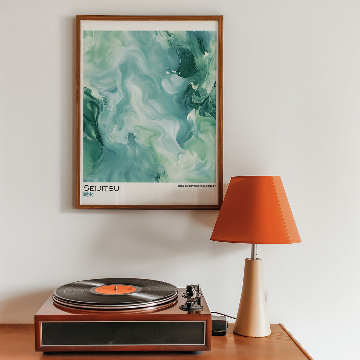 Teal and moss green marble print in a walnut frame above a sideboard with a record player