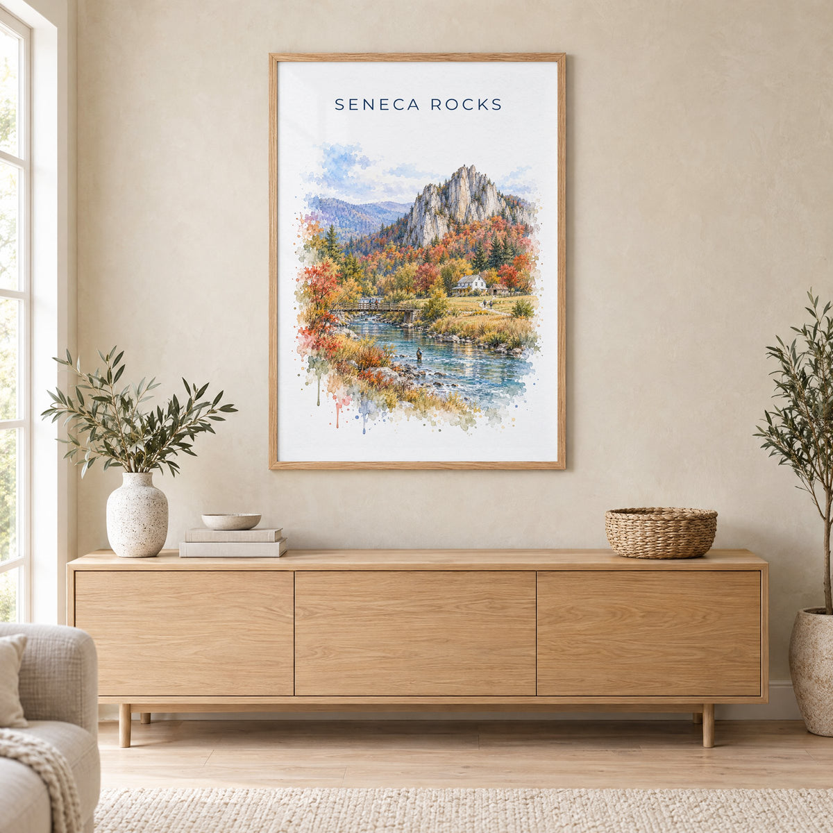 Seneca Rocks watercolor print in an oak frame above a light wood sideboard in a Scandinavian living room