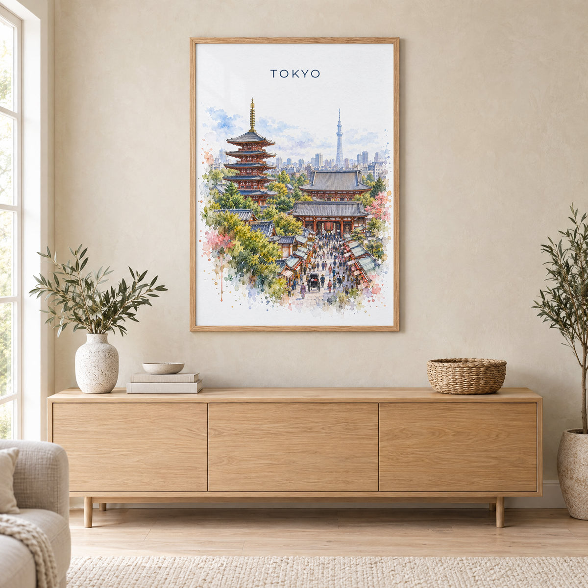Senso-ji watercolor print in an oak frame above a light wood sideboard in a Scandinavian living room