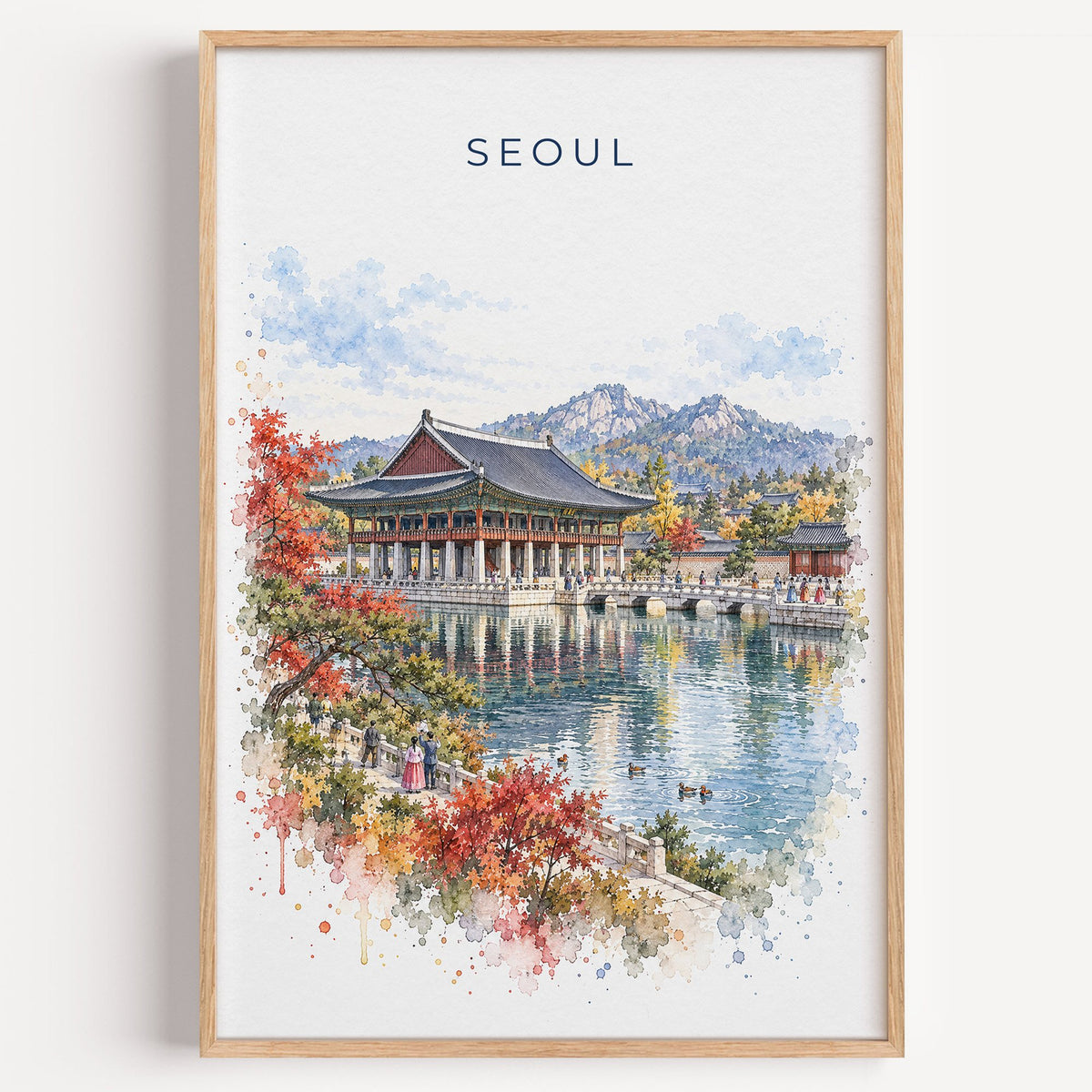 Seoul watercolor print in a light oak frame on a plain white wall