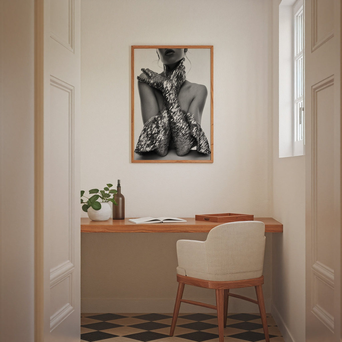 Crossed arms in sequin opera gloves print in an oak frame above a home office desk nook