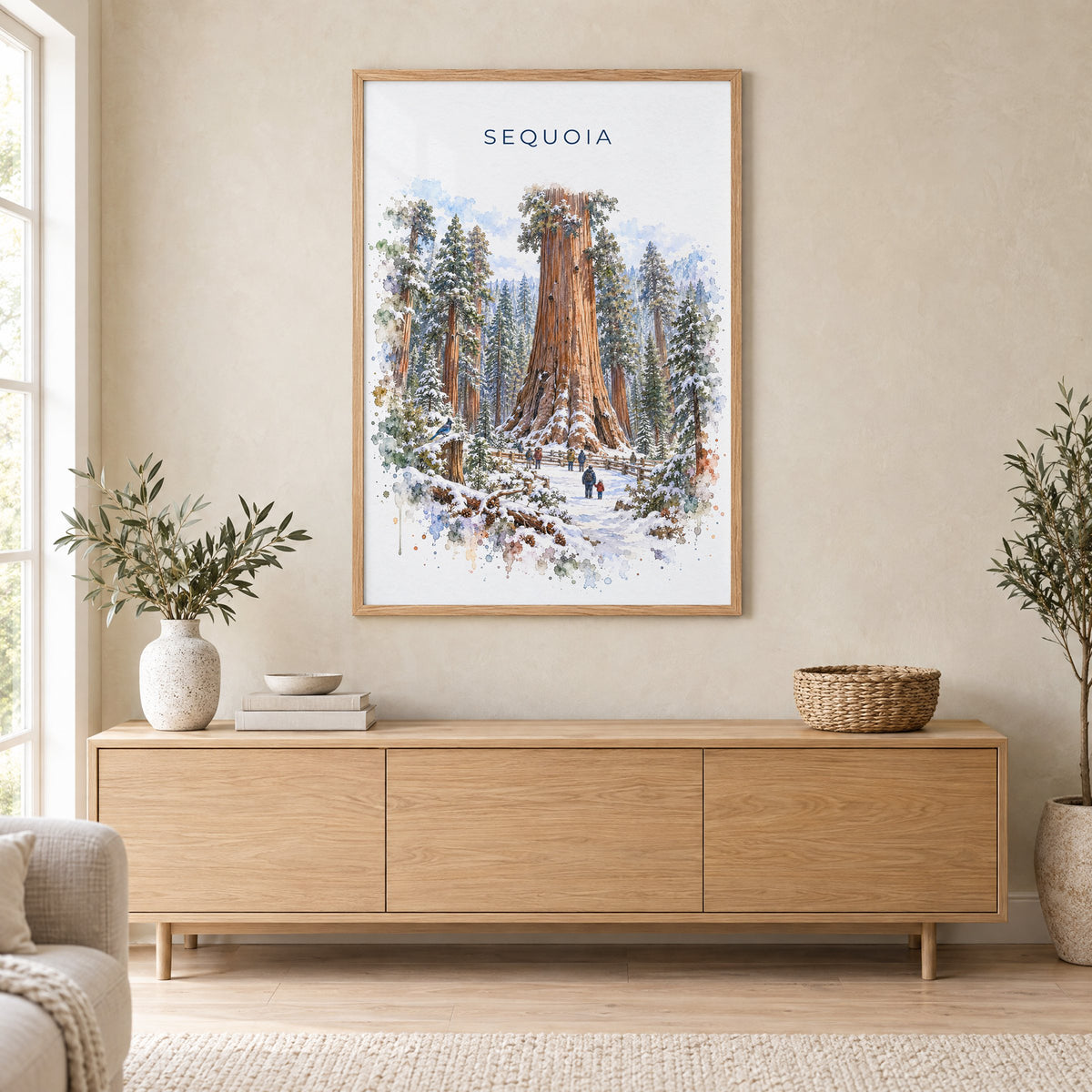 Sequoia National Park watercolor print in an oak frame above a light wood sideboard in a Scandinavian living room