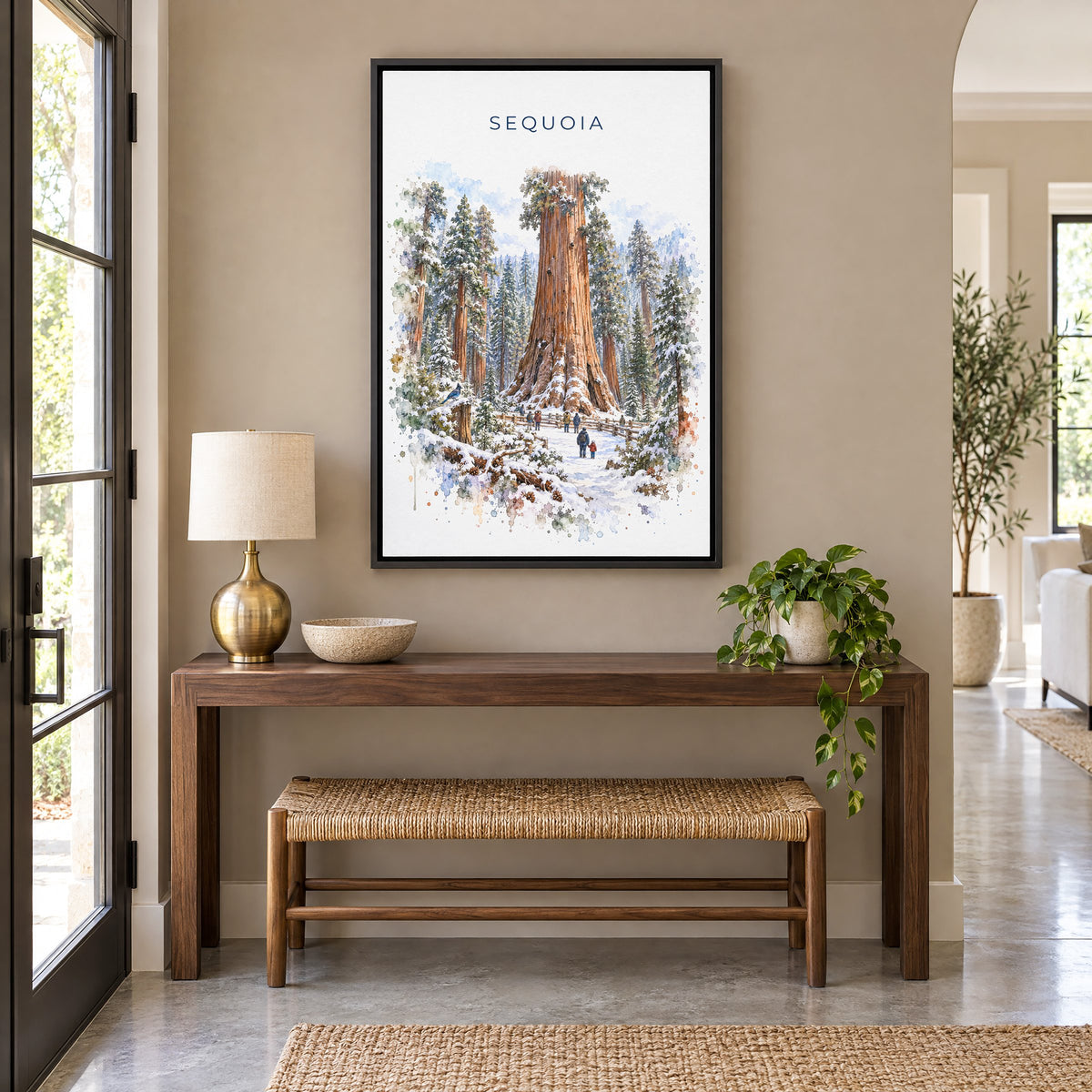 Sequoia National Park watercolor print as a black floater canvas above a walnut console and woven bench in an entryway